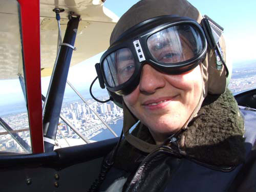 Lynn Oakey in bi-plane over Seattle