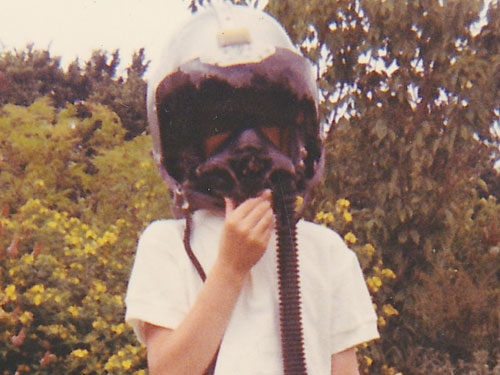 Young Mick Oakey wearing bone-dome flying helmet